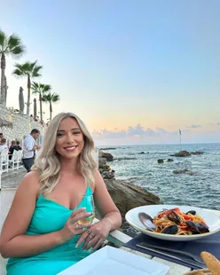 Cretan Blue restaurant in Hersonissos, seafront dining with sunset view, pitta with dips, seafood linguine, and rack of lamb.