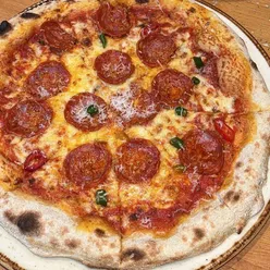 Bruschetta, spicy pepperoni pizza, and raspberry panna cotta at Villa Toscana, a hidden gem in Glasgow, fresh and delicious.