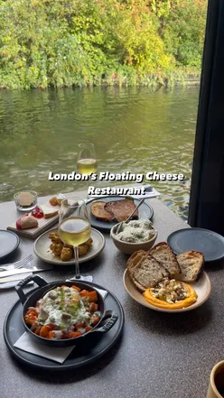 British cheese plates on a canal boat in Paddington, featuring curried cheddar curds, grilled cheese toasties, and Albariño wine.