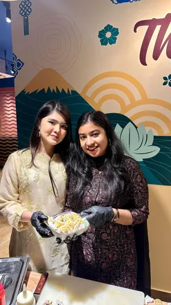 Celebrating 1st anniversary at Teriyaki, enjoying sushi and momo with friends in Dhaka, Bangladesh.