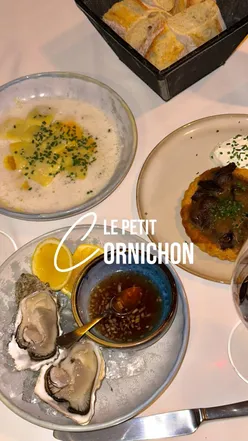 French dining at Le Petit Cornichon in Marrakech with champagne, oysters, shallot tart, lobster pasta, and red wine.