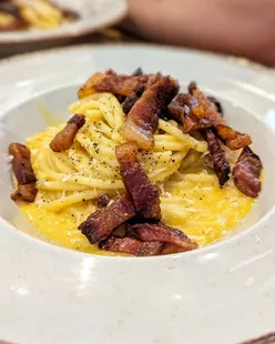 Delicious carbonara and pistachio pasta at Ornella's Kitchen, Denton, Manchester; try with beef meatballs, tiramisu, and profiterole.