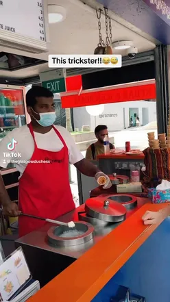Man entertaining with ice cream cone in Singapore, perfect for foodies and travelers. #icecream #entertainment