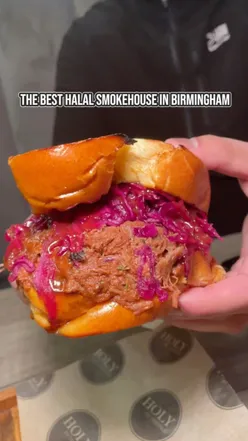 Delicious smoked meats at Holy Smokes BBQ in Birmingham, featuring short rib, loaded brisket fries, and The Ribwich.