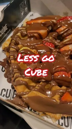 Delicious GoGo waffle topped with chocolate, sprinkles, berries, and coconut, alongside Nutella and Biscoff desserts.