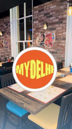 Delicious Indian dishes like Butter Chicken and Chilli Chicken at My Delhi-Leicester's vibrant dining experience.
