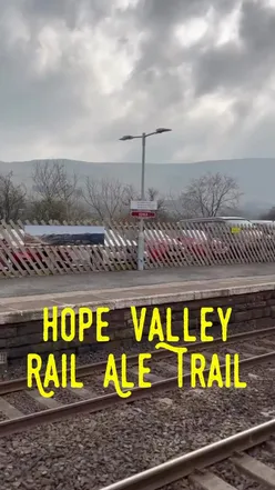 Group enjoying drinks and food at a cozy pub on the Hope Valley Rail Ale Trail from Sheffield.