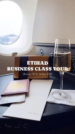 Etihad Business Class on Boeing 787 Dreamliner with spacious lay flat beds and exquisite food service.