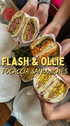 Focaccia sandwiches at Flash and Ollie Kitchen pop-up in Edinburgh, featuring vibrant interior, leather sofas, and cocktail menu.