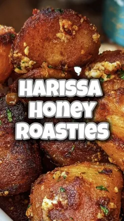 Delicious harissa honey roast potatoes, golden and crispy, perfect for a spicy, sweet side dish.