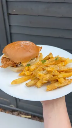 Classic burger meal with cheese and dirty fries from Miss Millie's Chicken, Edinburgh. Delicious and memorable taste.