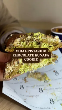 Viral pistachio chocolate kunafa cookie from Leicester's Butter Brulee, showcasing a delicious dessert treat.