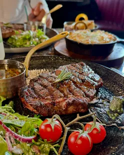 Argentinian grill date night with beef brisket taco, 12oz ribeye, mac and cheese, and dauphinois potatoes in Edinburgh.
