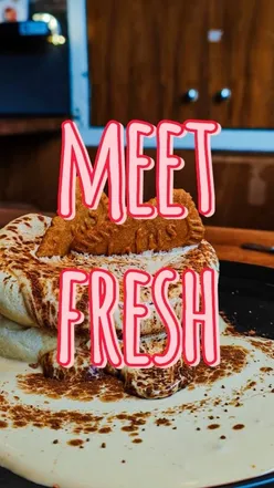 Tiramisu and lemon cheesecake soufflé pancakes with passionfruit lemonade at Meet Fresh Edinburgh, perfect for food lovers.
