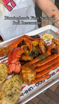 Seafood boil at Birmingham's first seafood boil restaurant, Seafood City, featuring Cajun sauce, shrimp, crab, and lobster.