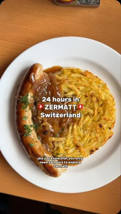 Couple enjoying Swiss rosti at Sunnegga buffet in Zermatt, with Matterhorn views in the background.