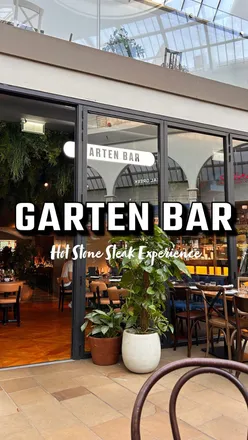 Delicious hot stone steak experience with unlimited rump, sirloin, sourdough, salad, and fries at Garten Bar.