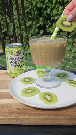Refreshing matcha bubble tea in a glass with tapioca pearls, perfect for summer days. Green tea drink, summer beverage.