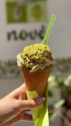 Delicious pistachio ice cream in Taormina, showcasing vibrant green color and creamy texture, perfect for summer.
