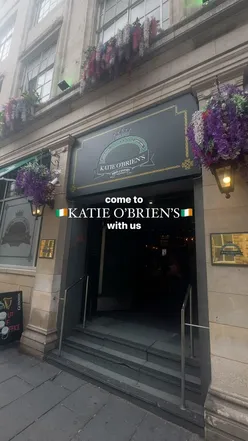 Colorful cocktails and pints of Guinness at Katie O'Brien's in Newcastle, with live music creating a vibrant atmosphere.