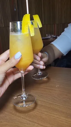 Brunch at Garten Bar, MCR: steak & eggs, refreshing mojitos, and vibrant cocktails in a lush, modern setting.