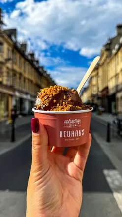 Takeaway chocolate mousse from Neuhaus Chocolates in Bath, featuring dark chocolate with caramelized almonds topping.