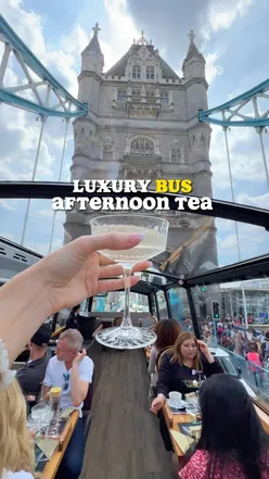 Luxury bus serving afternoon tea with champagne, offering a unique London sightseeing experience.