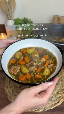 Slow cooked minted lamb stew with diced lamb, carrots, potatoes, peas, and mint sauce, served with part-baked baguette.