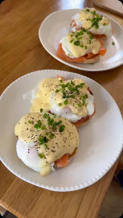 Delicious Eggs Royale brunch dish by Chef Sam, featuring poached eggs and smoked salmon on toasted English muffins.