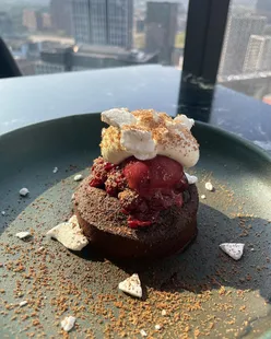 Skyline dining at 20 Stories Manchester with crispy duck salad, seared beef tataki, BBQ lamb rump, spiced cod loin, strawberry pavlova, and chocolate torta caprese.