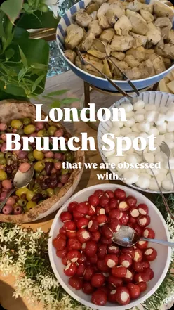 Delicious brunch spread at La Vo London featuring pastries, sandwiches, and fresh greens.