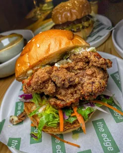 Preview of new menu at The Edge at Lil's in Witney featuring burgers, fried chicken, and tacos, known for quality food.