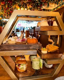 Afternoon chai at Prahna Indian Grill Edinburgh with masala chai, grilled chicken sliders, salmon wraps, and flower ceiling decor.