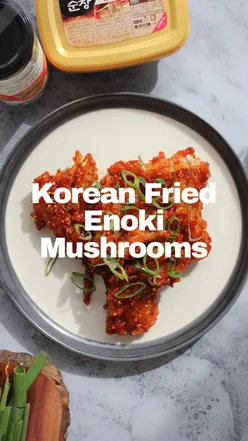 Crispy Korean fried enoki mushrooms with sticky gochujang Yangnyeom sauce.
