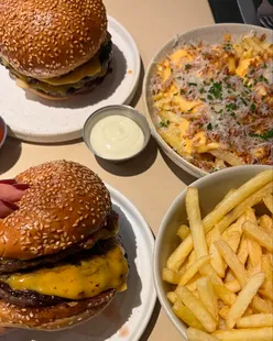 Burgers at Milkbun Bristol: Bronx with aged beef, milk bun, pickles; Pablo with chilli jam, bacon, peanut butter; Bronx fries.