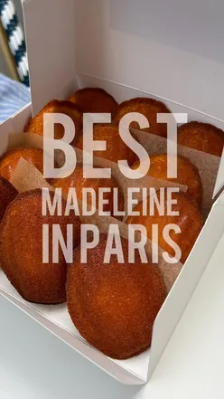 Delicious madeleines from Le Comptoir de Madeleine in Paris, showcasing their golden crust and rich buttery flavor.