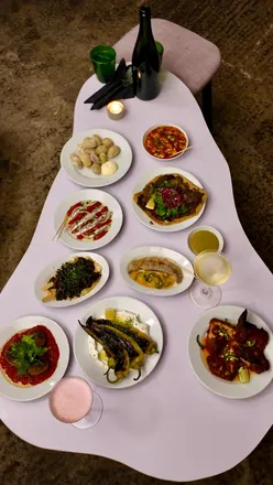 Delicious dishes from The Pearl at Park Hill, Sheffield, including anchovies, skewers, and mussels with cocktails.