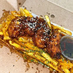 Loaded sticky Korean chicken tenders with bacon cheese fries and Mexican gravy dip at Davey's UK, Lowfell.