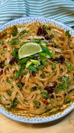 Delicious peanut butter, coriander, and lime noodles topped with crispy chili oil and sesame seeds.