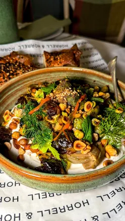 Festive dinner in Somerset featuring Persian bread, brisket, and marmalade cake in a cozy, decorated venue.