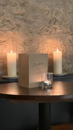 Celebrating the launch of Zibibbo Glasgow with white wine and canapรฉs in a cozy, warm interior.