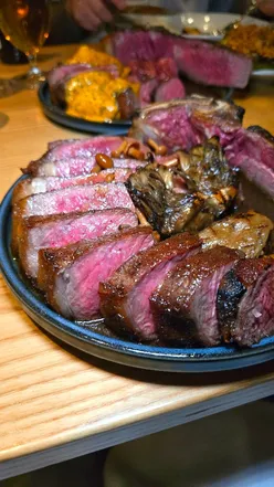 Club steak with cafe de Paris butter and two sauces at Brett Restaurant, Glasgow. Perfect for steak lovers.