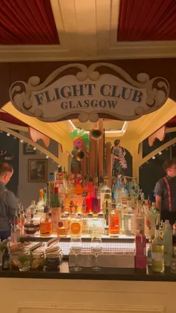 Flight Club Glasgow bar with festive cocktails, snowball margarita, fish and meat platter, and interactive darts games.