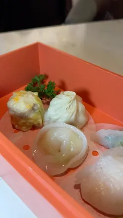 Delicious dishes at Oisois Sheffield: salt and chilli chicken, sticky ribs, dim sum, and vibrant cocktails.