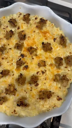 Baked mac and cheese with smoked cheddar, mature cheddar, and leftover stuffing, using Christmas cheese leftovers.