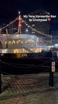 Floating Promenade Bar at Liverpool Waterfront with cocktails, elegant interiors, and stunning water views.