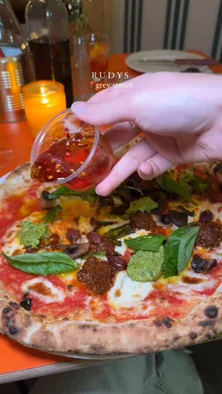 Delicious Neapolitan pizza from Rudy's in Newcastle, showcasing fresh ingredients and vibrant toppings.