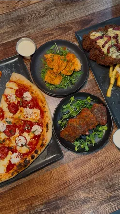 Delicious Italian dishes at Circo: mozzarella squares, hot honey pizza, vodka pasta, and desserts in Newcastle.