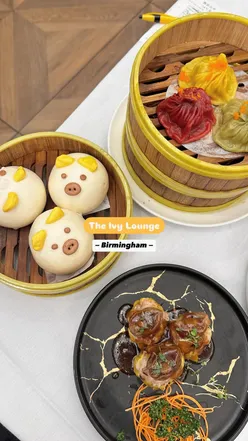Delicious dim sum brunch at The Ivy Lounge Birmingham, featuring king prawn rolls and jasmine tea.