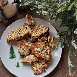 Festive Christmas 2024 moments: homemade biscotti, decorated tree, cozy fireplace, gingerbread houses, turkey toasties, winter sunset.